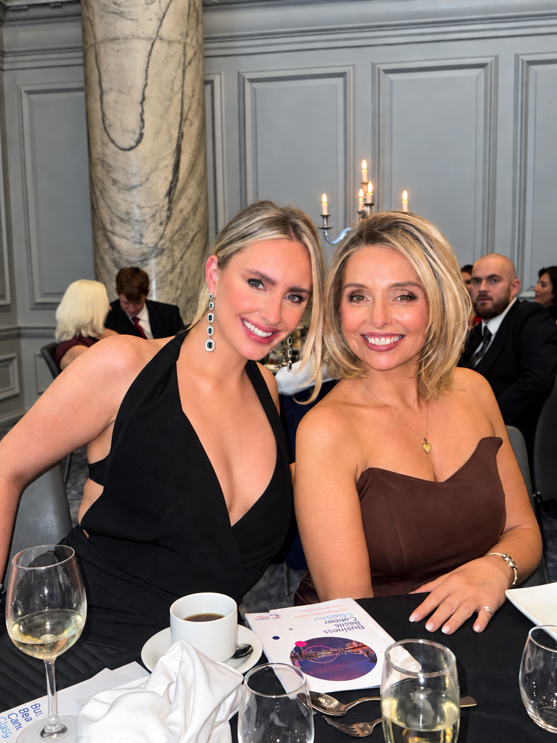 Francesca Devine and Mary Ann Smith smiling together at the Business Beats Cancer Glasgow dinner